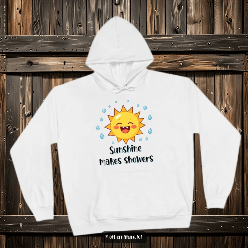 Funny sun character hoodie, cheerfully juggling raindrops with a wide smile, perfect for staying warm and amused.