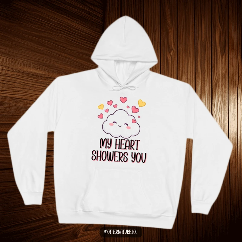 Funny Hoodie showcasing a tiny, cute cloud character giggling while raining colorful hearts, perfect for cozy, cute, and fun-loving wear.