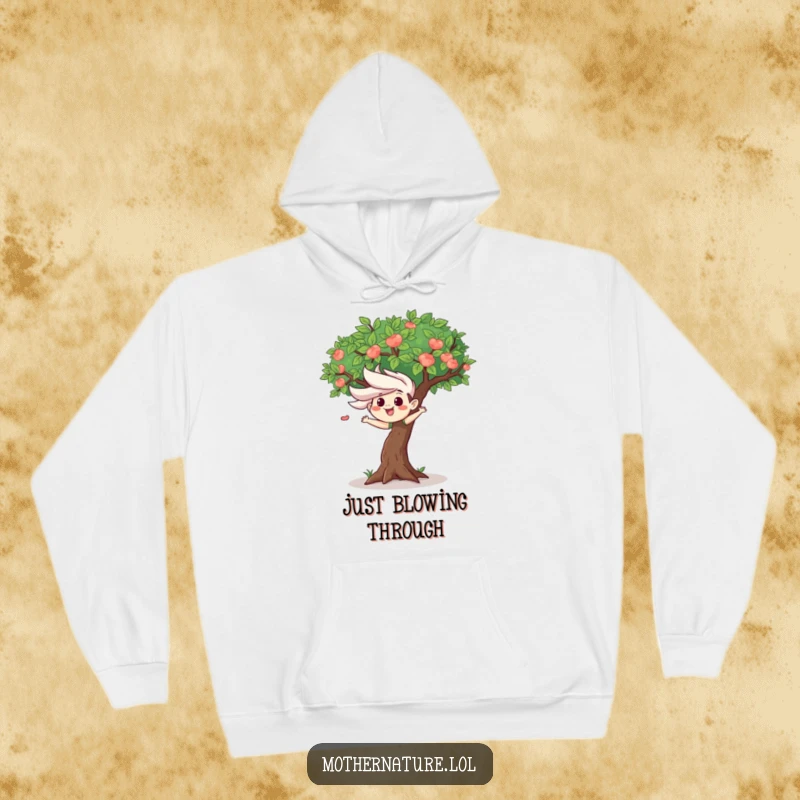 Mischievous wind gust character ruffling leaves of a happy tree, featured on a warm hoodie, for cozy, playful wear.