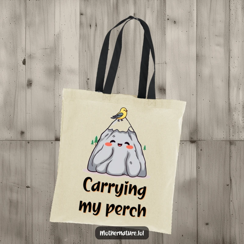 Funny tote bag with a mountain character shrugging amiably, a bird lands on its peak.