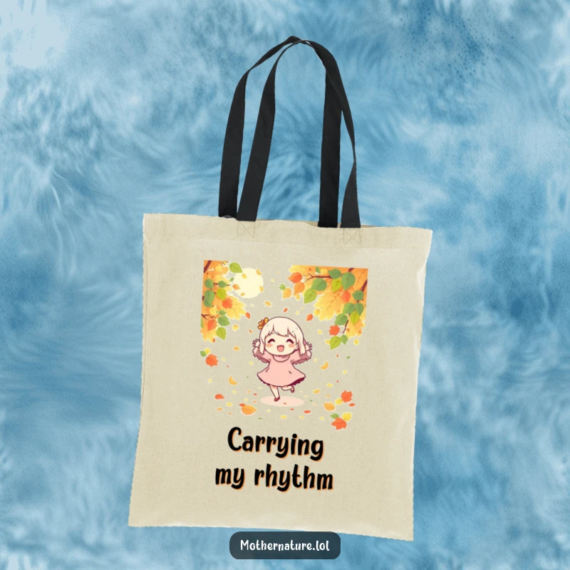 Funny tote bag with a character joyfully dancing in a scene of falling leaves and sunshine.